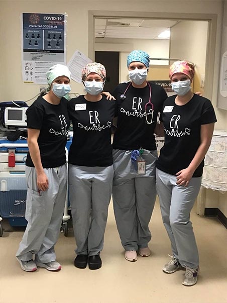 Groves Hospital Emergency Department Nursing Staff pose with customized t-shirts and donated scrub caps during the COVID-19 pandemic, in the legacy Groves Emergency Department (June 2020)